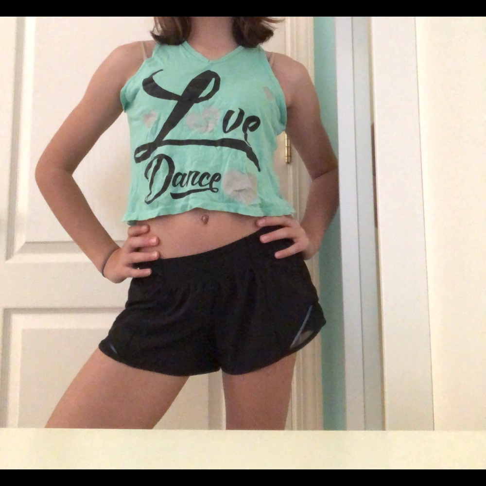 A teal dance shirt, with heart back cut out.